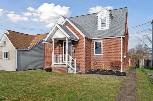 new england style home featuring a front lawn