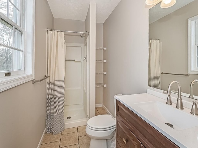 bathroom with vanity, a shower with curtain, tile patterned flooring, toilet, and a textured ceiling