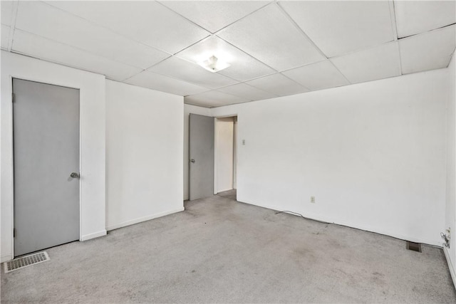 unfurnished room with a paneled ceiling