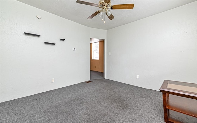 carpeted empty room with ceiling fan