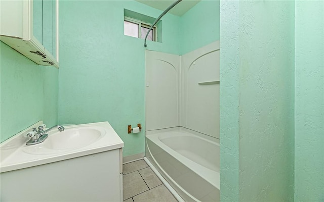 bathroom featuring bathtub / shower combination, vanity, and tile patterned floors