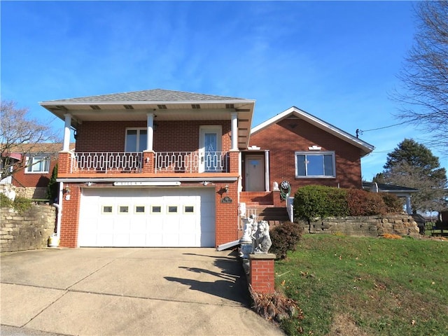 view of front of home featuring a garage and a front lawn