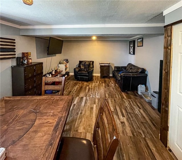 interior space featuring a textured ceiling and hardwood / wood-style flooring