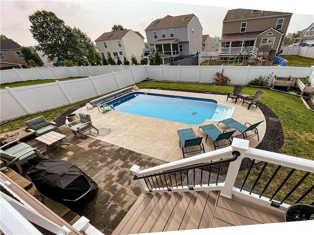 view of pool with a deck and a patio