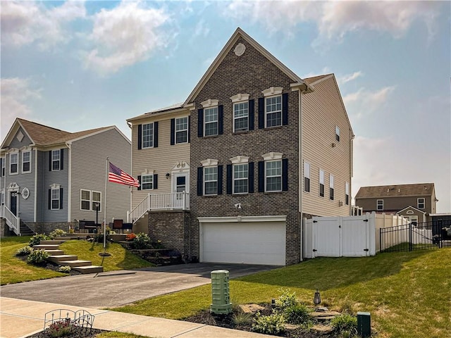 view of front facade with a front yard and a garage