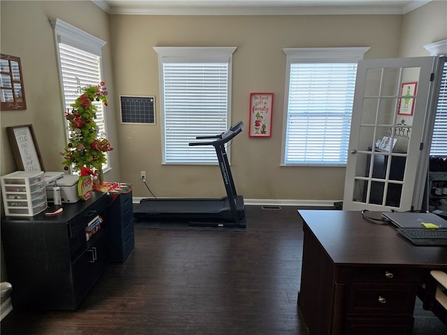 workout room featuring crown molding and dark hardwood / wood-style flooring