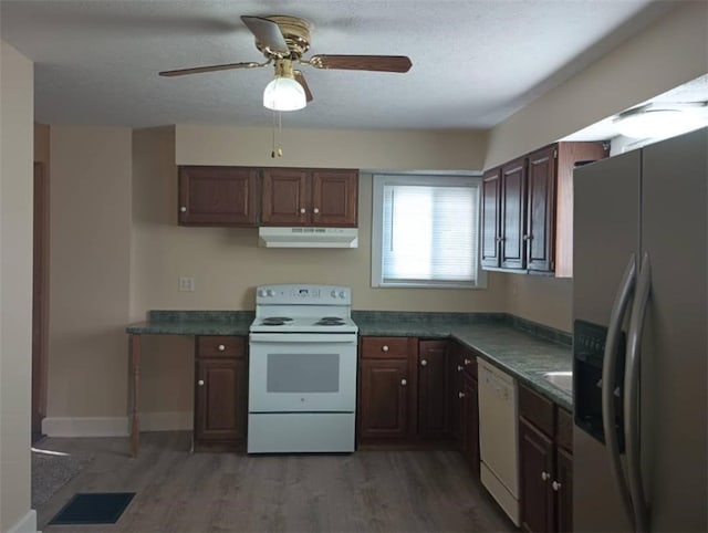 kitchen featuring ceiling fan, dark brown cabinets, dark wood-type flooring, and white appliances