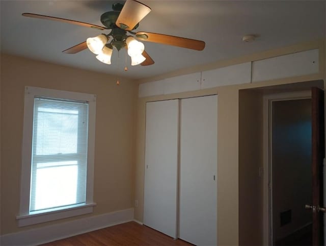 unfurnished bedroom with hardwood / wood-style floors and ceiling fan