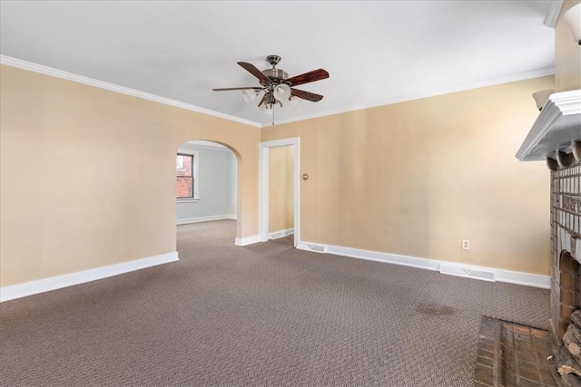 unfurnished living room featuring carpet, ceiling fan, ornamental molding, and a fireplace