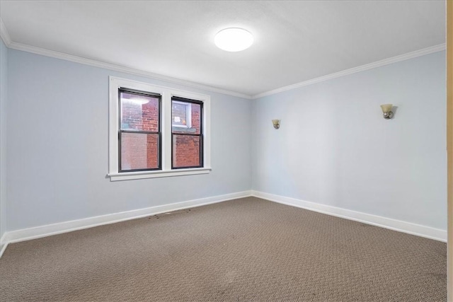 carpeted spare room featuring crown molding