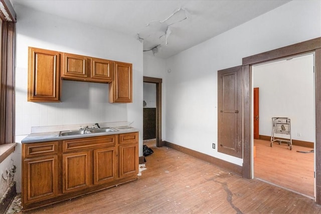 kitchen featuring sink and light wood-type flooring