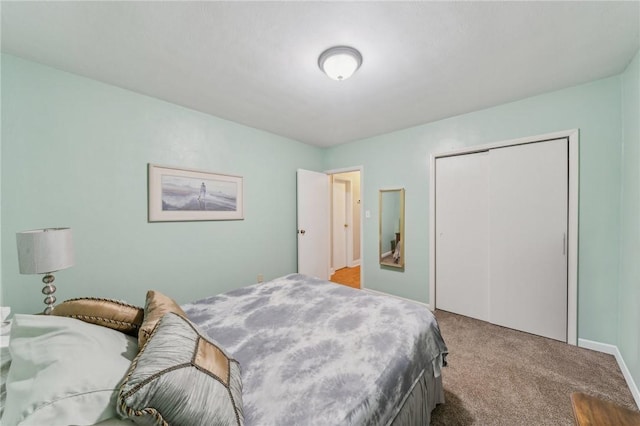 bedroom with a closet and carpet floors