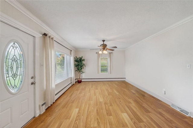 entrance foyer featuring baseboard heating, ceiling fan, ornamental molding, and light hardwood / wood-style flooring