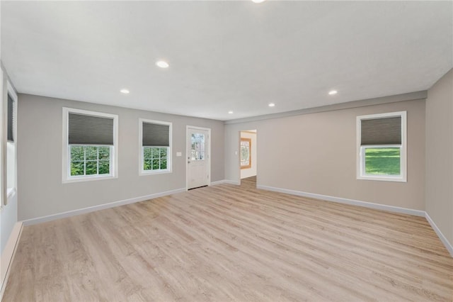 unfurnished living room with light hardwood / wood-style flooring