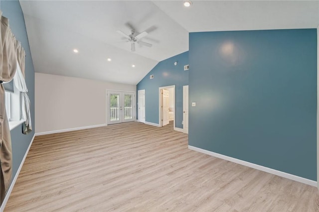 unfurnished living room featuring vaulted ceiling, french doors, ceiling fan, and light hardwood / wood-style flooring