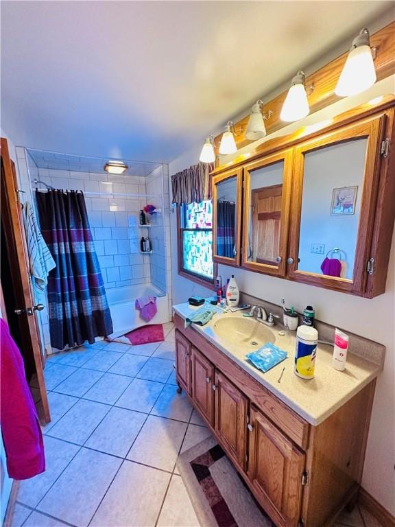 bathroom featuring a shower with shower curtain, tile patterned flooring, and vanity