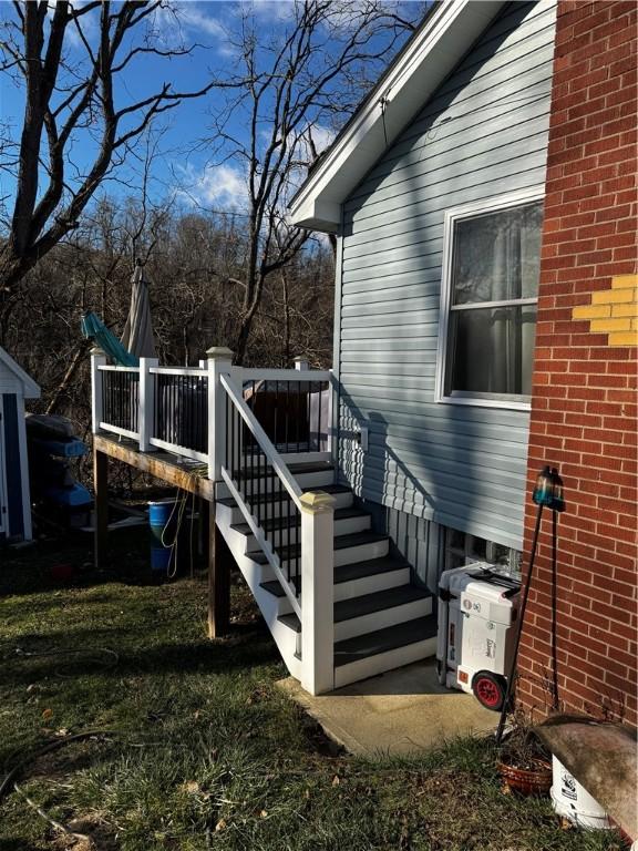 view of home's exterior with a wooden deck