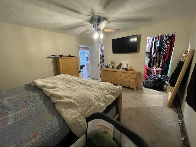 bedroom with ceiling fan and light colored carpet