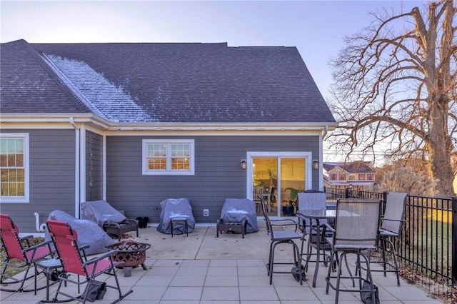 back of house featuring a patio and an outdoor fire pit