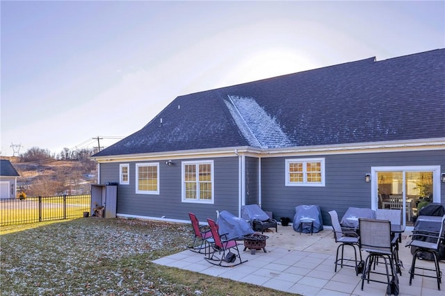 back of house featuring a patio and an outdoor fire pit