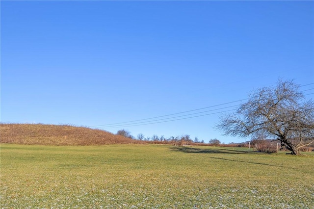 view of yard with a rural view