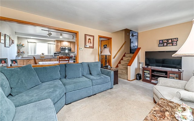 living room featuring light carpet