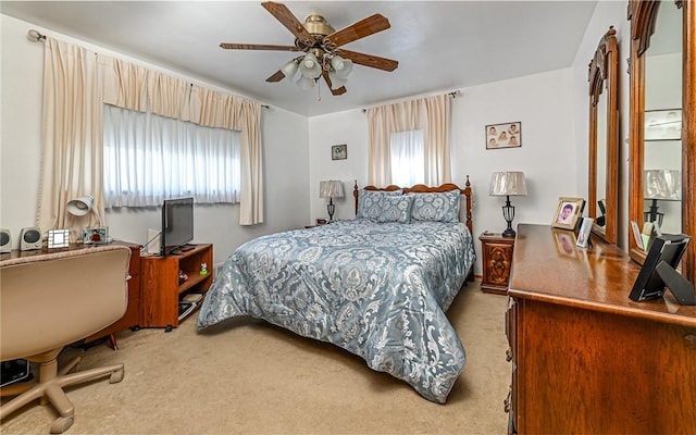 bedroom featuring carpet, multiple windows, and ceiling fan