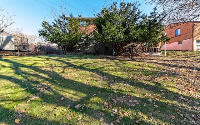 view of yard with a trampoline