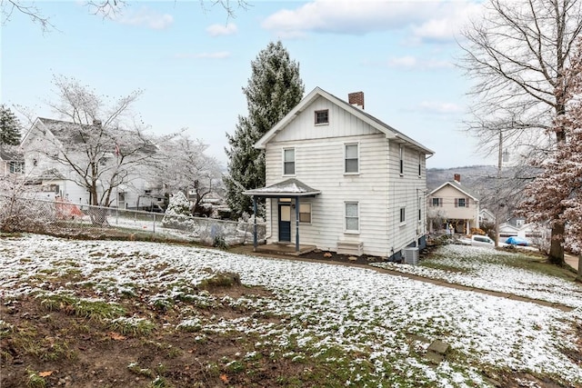 view of snow covered house