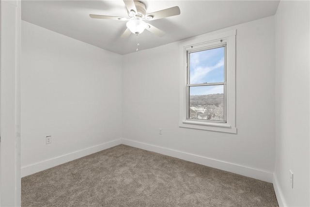 spare room with light carpet and ceiling fan