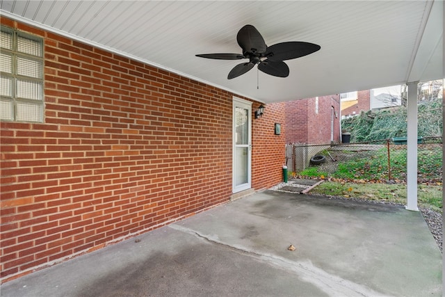 view of patio / terrace featuring fence and a ceiling fan