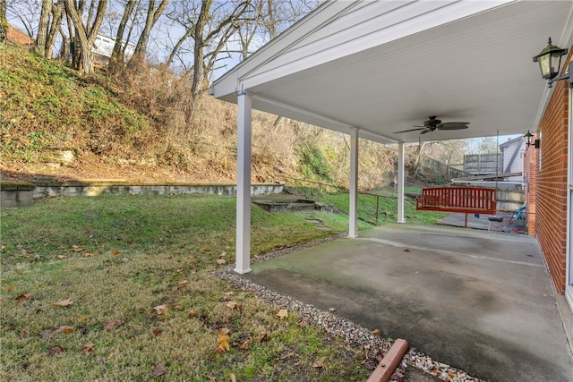 view of patio featuring a water view and a ceiling fan