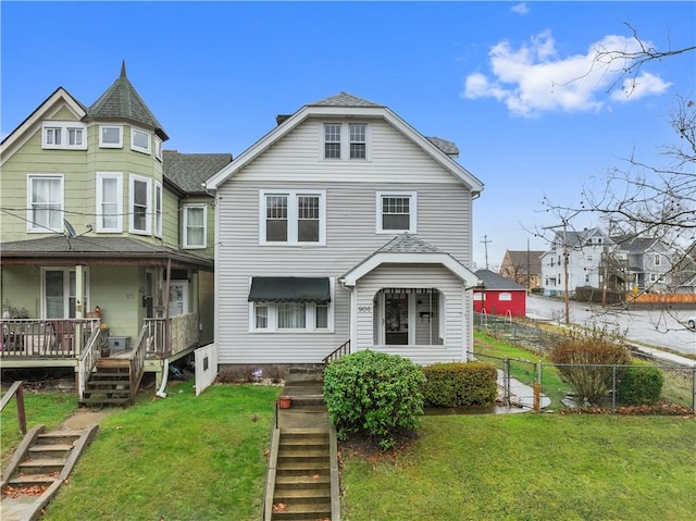 view of front of home featuring a front lawn and covered porch