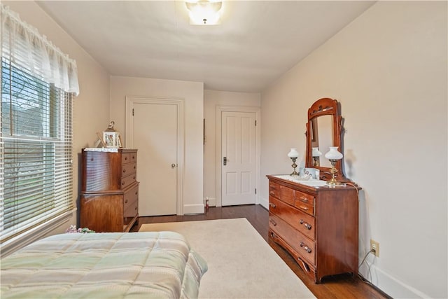 bedroom with hardwood / wood-style flooring