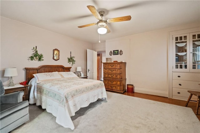 bedroom featuring ceiling fan and hardwood / wood-style floors