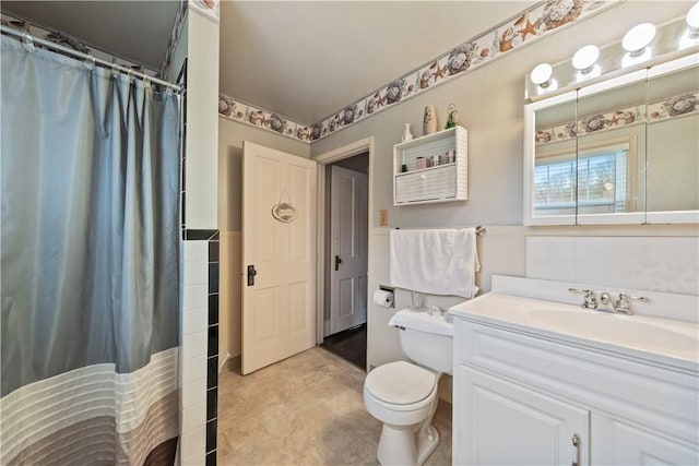 bathroom with vanity, toilet, and walk in shower