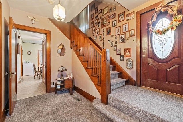 entrance foyer featuring carpet flooring