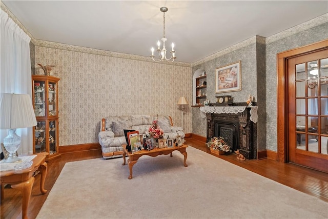 living room with a chandelier and hardwood / wood-style floors