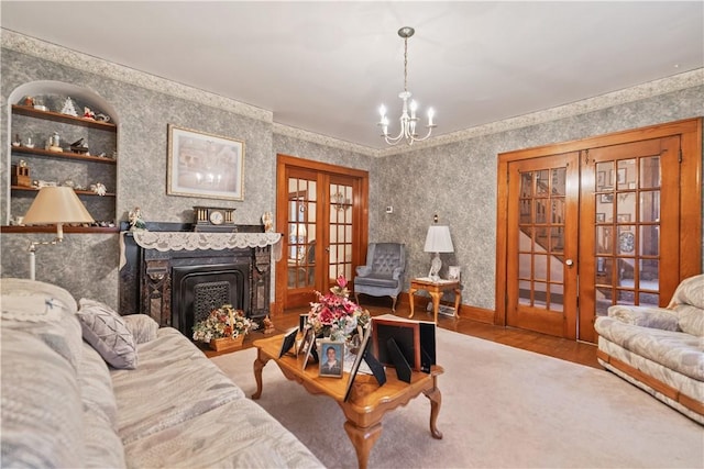 living room featuring a notable chandelier and french doors