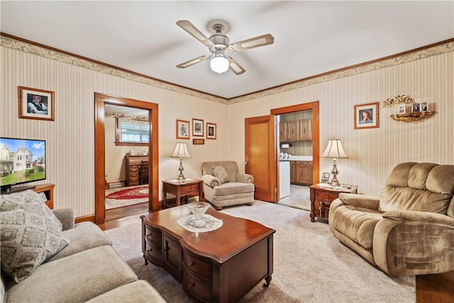 living room featuring light colored carpet and ceiling fan