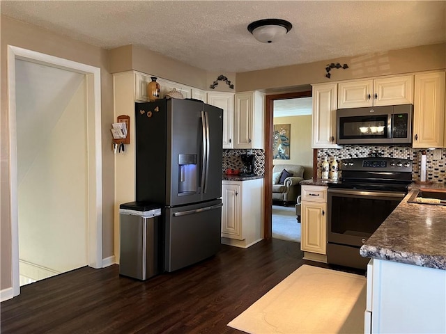 kitchen with decorative backsplash, appliances with stainless steel finishes, a textured ceiling, dark wood-type flooring, and white cabinets