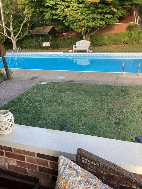 view of swimming pool with a gazebo