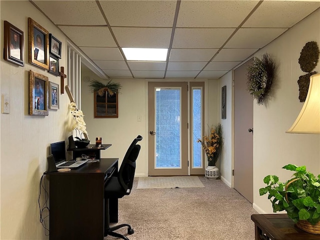 carpeted office with a drop ceiling