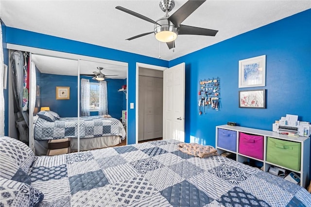 bedroom with ceiling fan and a closet