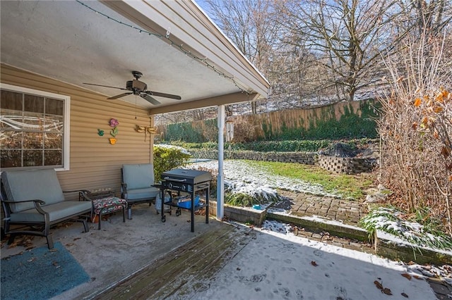 view of patio featuring area for grilling and ceiling fan