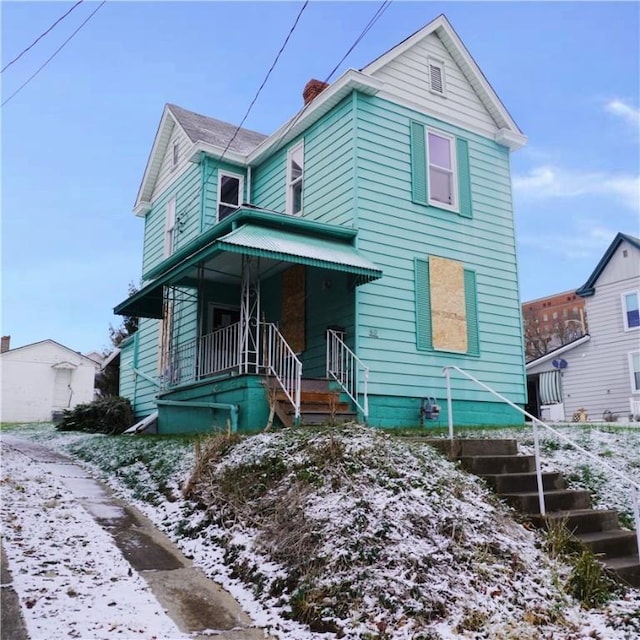 view of front property featuring covered porch