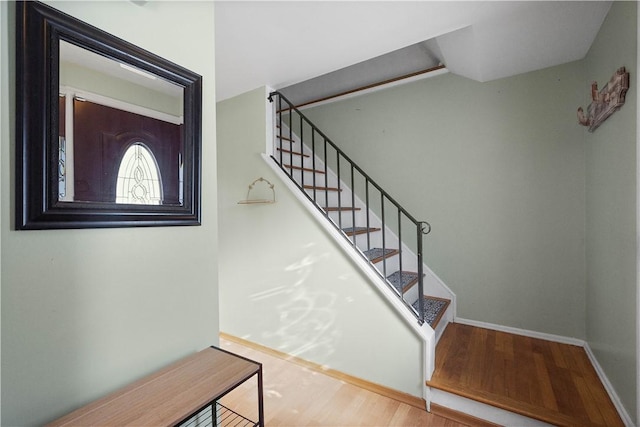 stairway with wood-type flooring