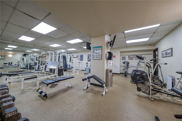 workout area featuring a paneled ceiling