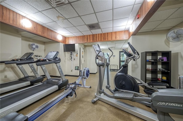 exercise room with a drop ceiling and carpet floors