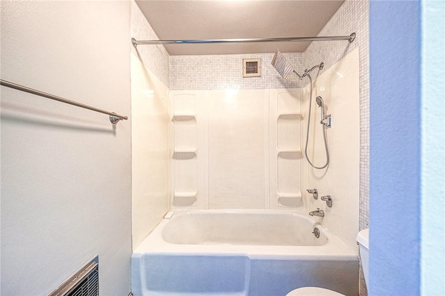 bathroom featuring toilet and shower / washtub combination